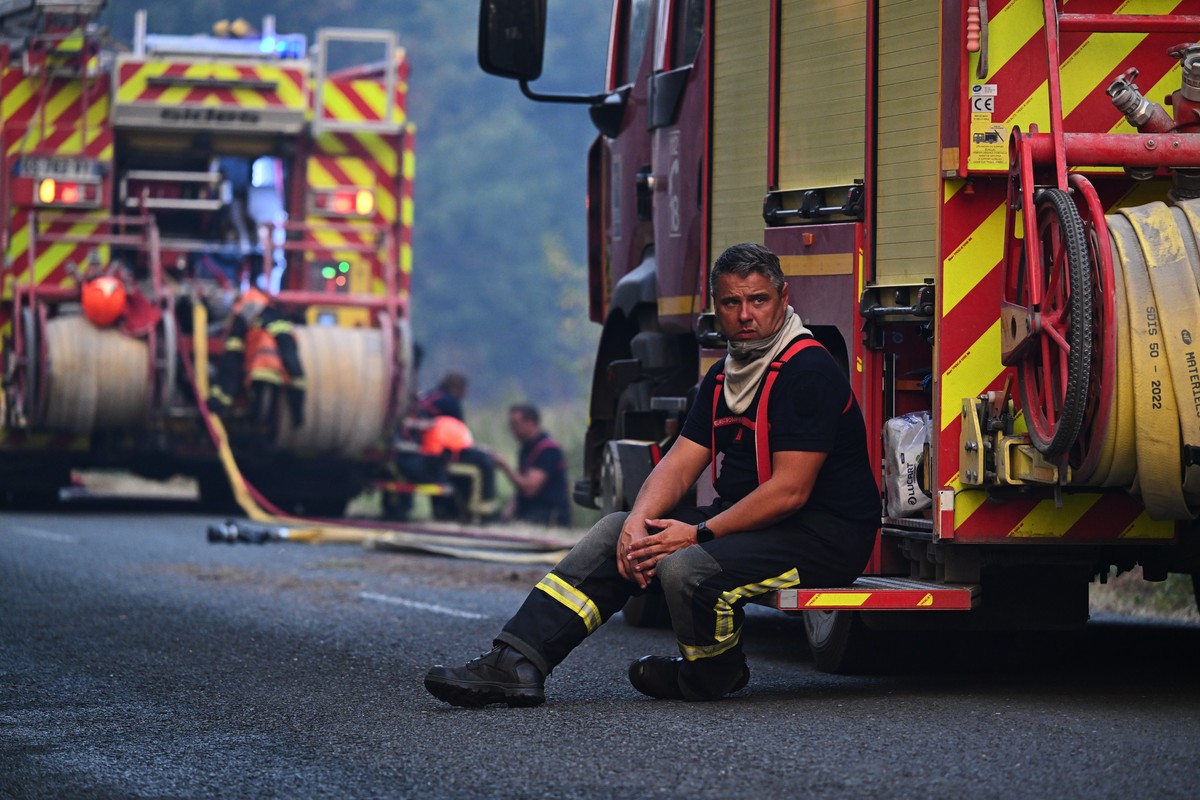 A firefighter takes a break and sits on his engine after fighting a fire outside Lanton, during wildfires in southwestern France, Tuesday, July 28, 2026. (AP Photo/Emma Da Silva)
France Wildfires