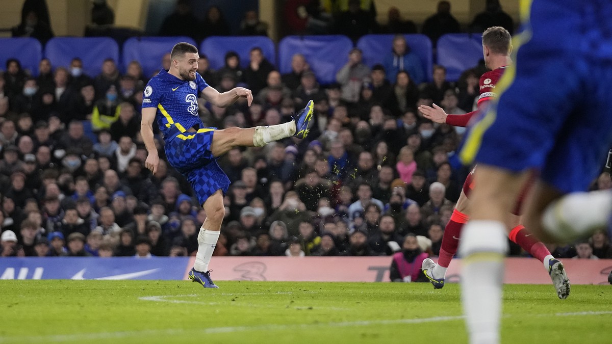 Chelsea's Mateo Kovacic scores his side's opening goal during the English Premier League soccer match between Chelsea and Liverpool at Stamford Bridge in London, Sunday, Jan. 2, 2022. (AP Ph ...