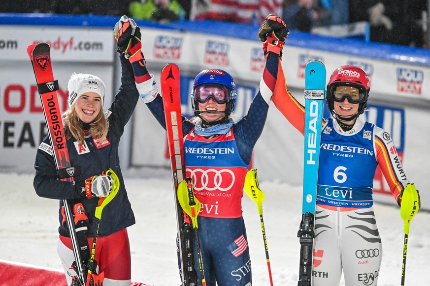 epa11724377 Second placed Katharina Liensberger of Austria (L), winner Mikaela Shiffrin of United States (C) and third placed Lena Duerr of Germany (R) celebrates at the finish area after the Women?s  ...