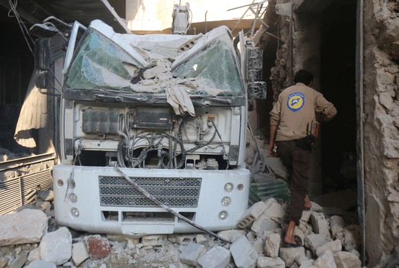 A civil defence member inspects the damage after their centre was hit by an airstrike hit in a rebel held area of Aleppo, Syria August 12, 2016. REUTERS/Abdalrhman Ismail