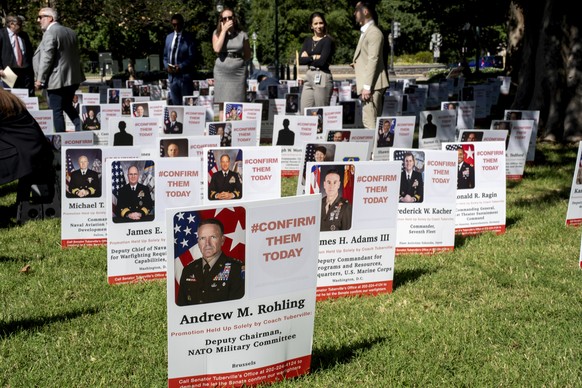 A display is seen on the Capitol grounds showing the members of the military whose promotions are being held up by Sen. Tommy Tuberville, R-Ala., in Washington, Tuesday, Sept. 19, 2023. (AP Photo/J. S ...