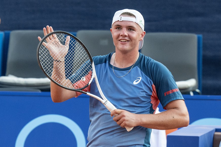 epa10080287 Dominic Stricker of Switzerland celebrate his victory against Marc Andrea Huesler of Switzerland at the Swiss Open tennis tournament in Gstaad, Switzerland, 19 July 2022. EPA/PETER SCHNEID ...