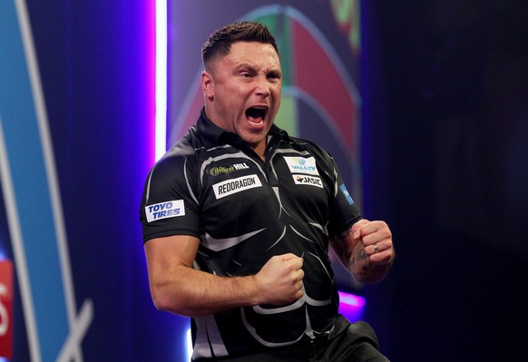epa08095274 Gerwyn Price of Wales as he plays Peter Wright of Scotland during the PDC World Darts Championship Semi-Final match at the Alexander Palace in North London, Britain, 30 December 2019. EPA/ ...