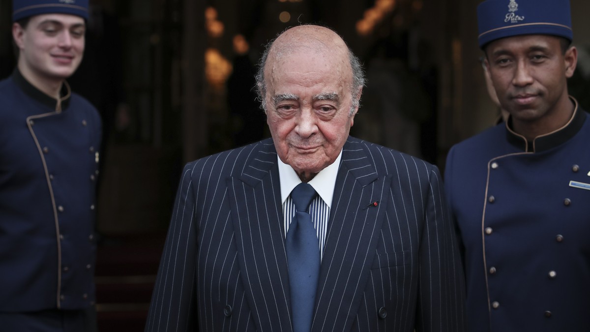 FILE - Egyptian businessman and Ritz hotel owner Mohammed Al Fayed poses with his hotel staff in Paris, Monday, June 27, 2016. (AP Photo/Kamil Zihnioglu, File)
