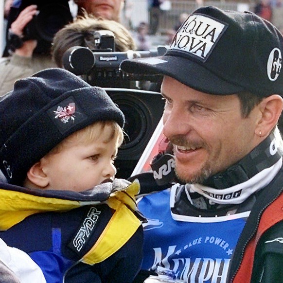 RECROPPED VERSION OF STA151-- Switzerland&#039;s Michael Von Gruenigen, right, is greeted by his son Noel after winning the gold medal in the men&#039;s giant slalom at the World Alpine Ski Championsh ...