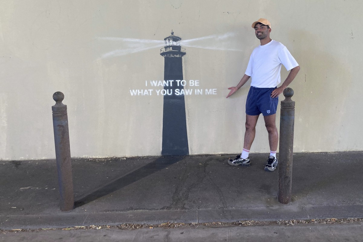 A man poses by an artwork by street artist Banksy, Friday, May 30, 2025 in Marseille, southern France. (AP Photo/Bishr Eltoni)
France Banksy