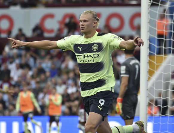 Manchester City's Erling Haaland celebrates after scoring his side's opening goal during the English Premier League soccer match between Aston Villa and Manchester City at Villa Park in Birmingham, En ...