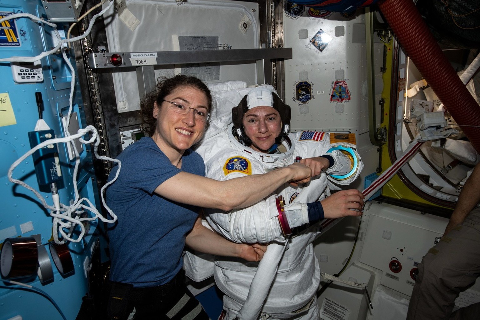 epa07929225 A photo provided by NASA shows NASA astronaut Christina Koch (L) posing for a portrait with fellow NASA Expedition 61 flight engineer Jessica Meir who is in a US space…