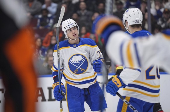 Buffalo Sabres&#039; JJ Peterka (77) and Jiri Kulich (20) celebrate Peterka&#039;s goal against the Vancouver Canucks during the third period of an NHL hockey game in Vancouver, British Columbia, Tues ...