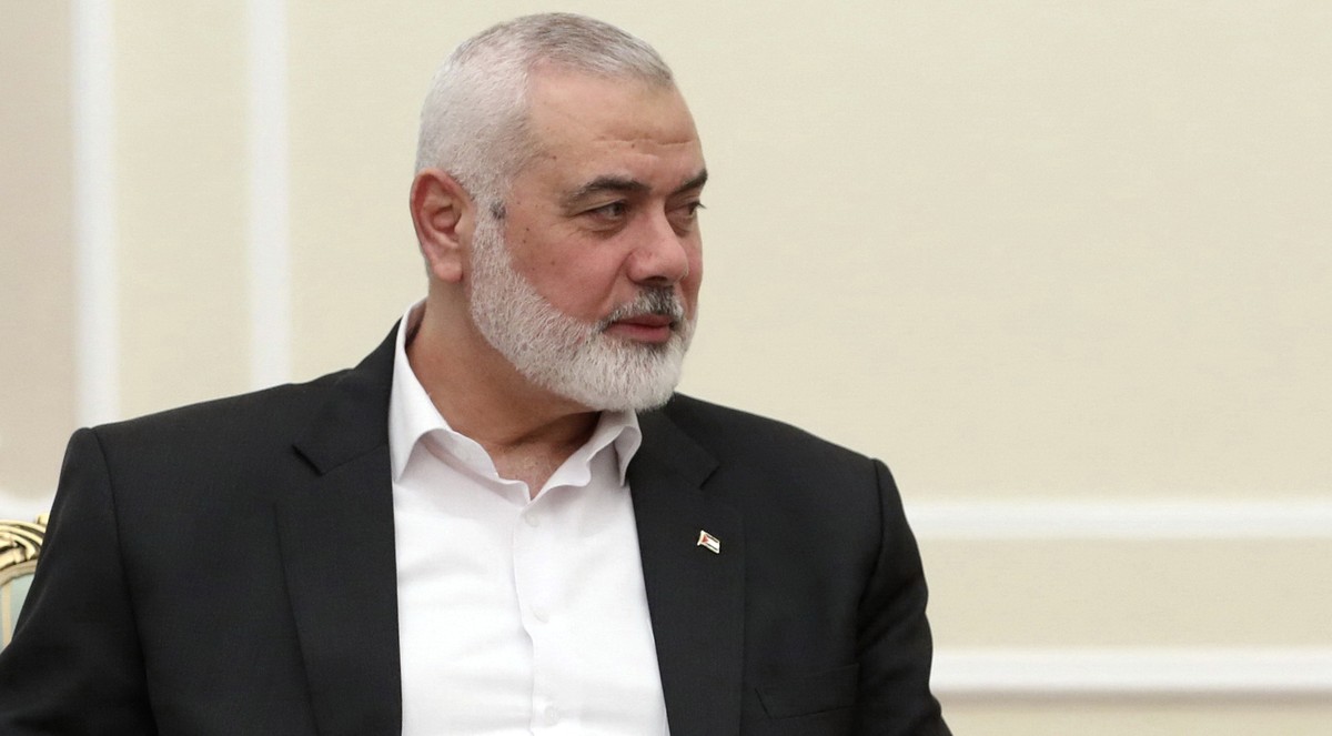 In this photo released by the Iranian Presidency Office, Hamas chief Ismail Haniyeh sits in a meeting with President Masoud Pezeshkian at the presidency office in Tehran, Iran, Tuesday, July 30, 2024. ...