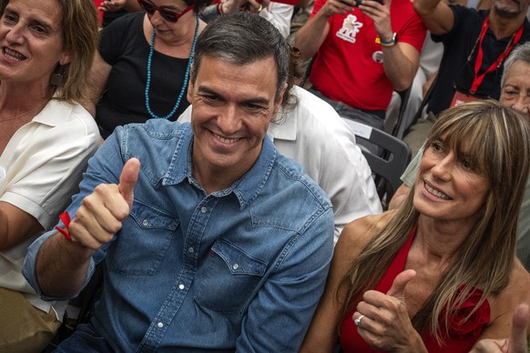 FILE, Spain&#039;s Prime Minister Pedro Sanchez next to his wife Begona Gomez, gives a thumb up during a campaign closing meeting in Madrid, Spain, Friday, July 21, 2023. S