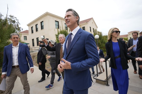 California Gov. Gavin Newsom, center, and his wife, first partner Jennifer Siebel Newsom, right, tour the campus of the Veterans Affairs of Greater Los Angeles, Friday, May 26, 2023, in Los Angeles . ...