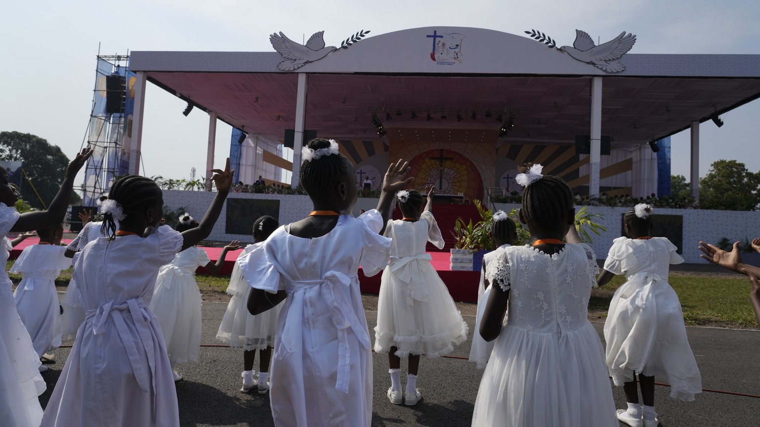 Children chant and dance as they with for PopeFrancis at Ndolo airport where he will preside over the Holy Mass in Kinshasa, Congo, Wednesday Feb. 1, 2023. Francis is in Congo and South Sudan for a si ...