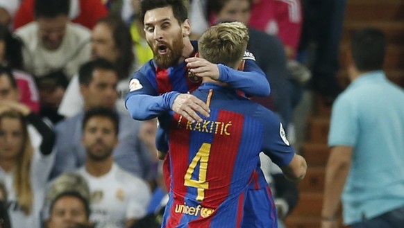 Barcelona&#039;s Ivan Rakitic, right, celebrates with his teammate Lionel Messi, after scoring during a Spanish La Liga soccer match between Real Madrid and Barcelona, dubbed &#039;el clasico&#039;, a ...