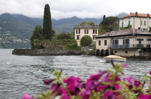 epa07665547 A general view from a street on Villa Oleandra, owned by US actor George Clooney, at Como Lake, northern Italy, 22 June 2019. According to reports, former US president Obama and his family ...
