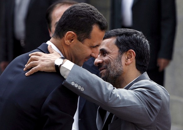 epa12241132 (FILE) - Iranian President Mahmoud Ahmadinejad (R) greets Syrian President Bashar al-Assad L) at the presidential palace in Tehran , Iran on 02 August 2008 (reissued 16 July 2025). Bashar  ...