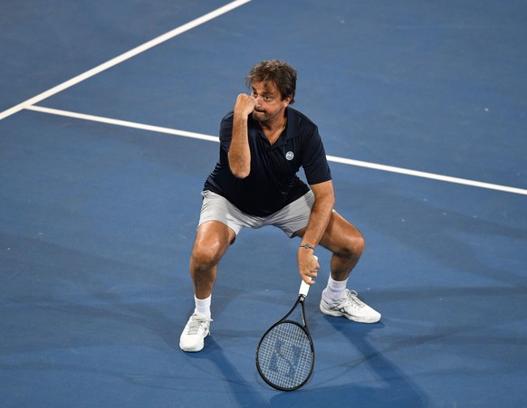 epa07269192 Henri Leconte is seen during his doubles match against Pat Cash and Daniel Munoz on day two at the World Tennis Challenge at Memorial Drive Park in Adelaide, Australia, 08 January 2019. EP ...