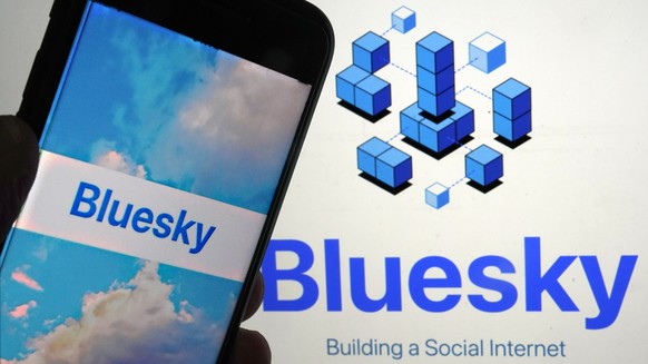 FILE - The app for Bluesky is shown on a mobile phone, left, and on a laptop screen, Friday, June 2, 2023, in New York. Bluesky, a Twitter-like social network championed by Twitter co-founder Jack Dor ...