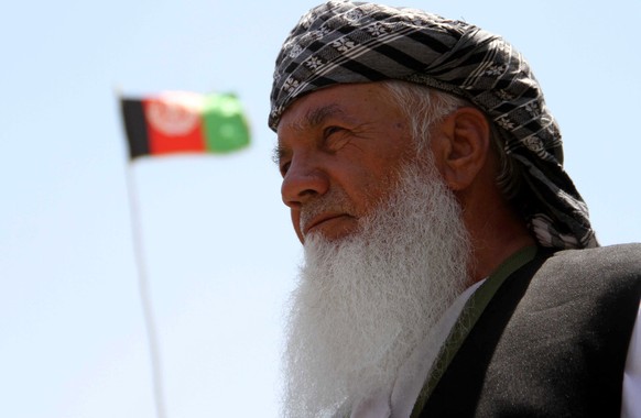 epaselect epa09400623 Ismail Khan, the former Mujahideen commander talks with supporters as security forces and Khan&#039;s loyal armed militia took back control of parts of Herat city following inten ...