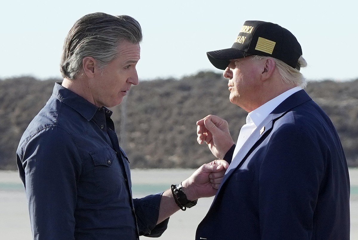 FILE - President Donald Trump talks with California Gov. Gavin Newsom after arriving on Air Force One at Los Angeles International Airport in Los Angeles, Jan. 24, 2025. (AP Photo/Mark Schiefelbein, F ...