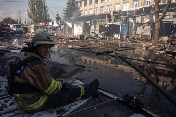 A Ukrainian soldier rests at the site of a destroyed market due to a Russian missile attack on September 6, 2023 in Kostiantynivka, Ukraine.  At least 16 people have been killed and dozens...