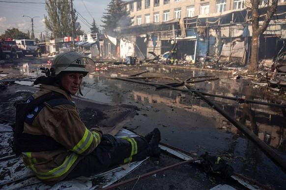 A Ukrainian soldier takes a rest on the site of destroyed market as a result of a Russian missile strike on September 6, 2023 in Kostiantynivka, Ukraine. At least 16 people have been killed and dozens ...