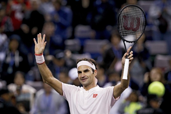 Roger Federer of Switzerland waves to spectators after defeating Daniil Medvedev of Russia in their men&#039;s singles match of the Shanghai Masters tennis tournament at Qizhong Forest Sports City Ten ...