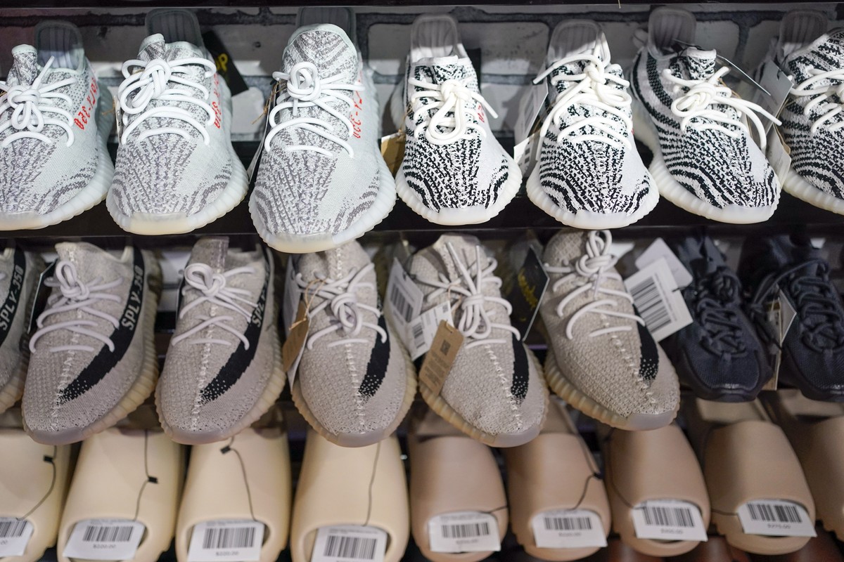 FILE - Yeezy shoes made by Adidas are displayed at Laced Up, a sneaker resale store, in Paramus, N.J., on Oct. 25, 2022. Adidas forecast it may have to write off the remaining 300 million euros ($320  ...