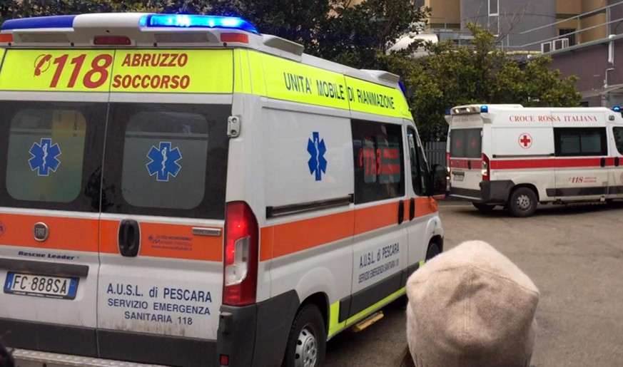 epa05734300 Ambulances arrive from Rigopiano hotel at Pescara hospital, in Pescara, Italy, 20 January 2017. The first ambulances carrying some of the six people pulled out of the avalanche hit, Hotel  ...