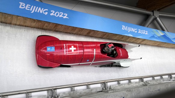 Melanie Hasler of Switzerland speeds down the track during a 2-woman bobsled training at the 2022 Winter Olympics, Tuesday, Feb. 15, 2022, in the Yanqing district of Beijing. (AP Photo/Mark Schiefelbe ...