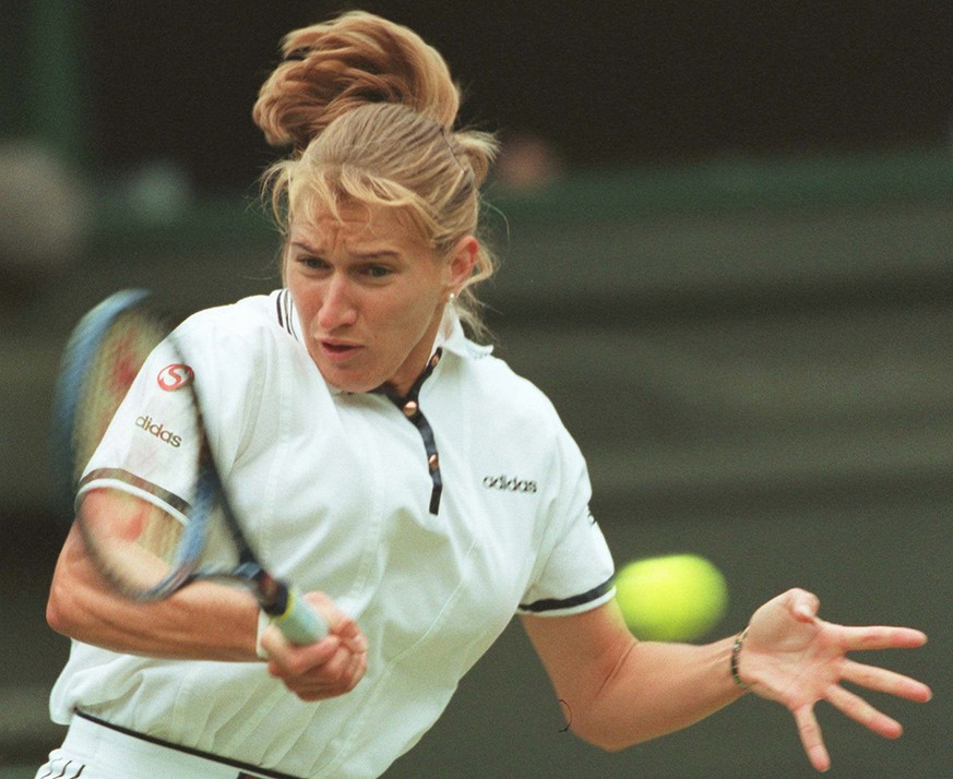 Defending champion Steffi Graf of Germany, plays a return to Nicole Arendt, from the U.S. during their third round match on Wimbledon's Centre Court, Saturday June 29 1996. Graf won the match 6-2, 6-1 ...