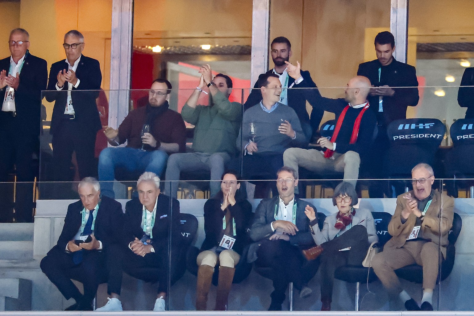 Swiss President Guy Parmelin, right, and his wife Caroline Parmelin, 2nd right, and Urs Kessler, President Swiss Ice Hockey Federation, 2nd left, cheer during the 2026 IIHF Men's Ice Hockey World ...