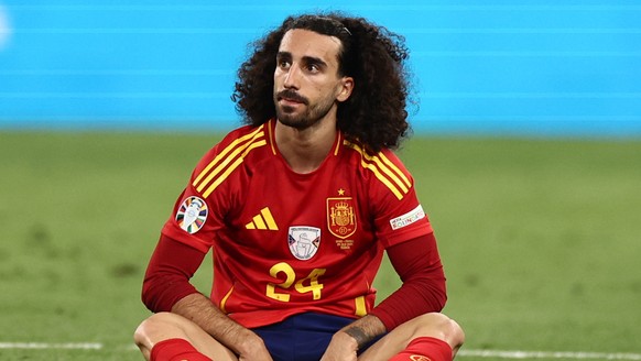 epa11469256 Marc Cucurella of Spain sits on the ground during the UEFA EURO 2024 semi-finals soccer match between Spain and France in Munich, Germany, 09 July 2024. EPA/ANNA SZILAGYI