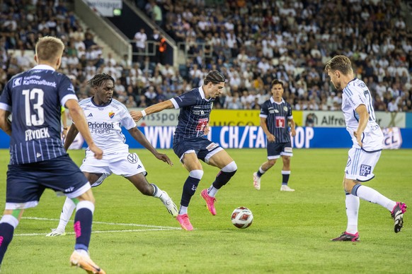 Kevin Spadanuda, centre, from Luzern and Joel Asoro, centre left, from Djurgardens play at the Conference League game between Switzerlands`s FC Luzern against Djurgardens IF from Sweden at the Confere ...