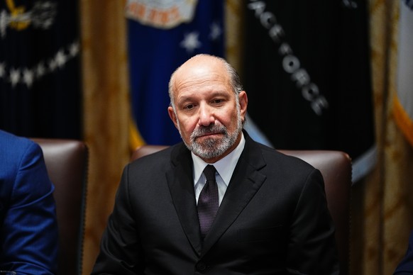 epa12324327 United States Secretary of Commerce Howard Lutnick looks on as US President Donald J Trump chairs a Cabinet meeting in the Cabinet Room of the White House in Washington, DC, USA, 26 August ...