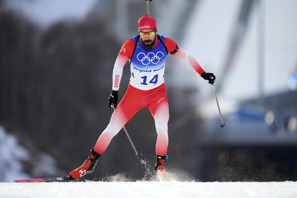 Benjamin Weger of Switzerland skis during the men's 10-kilometer sprint competition at the 2022 Winter Olympics, Saturday, Feb. 12, 2022, in Zhangjiakou, China. (AP Photo/Frank Augstein)