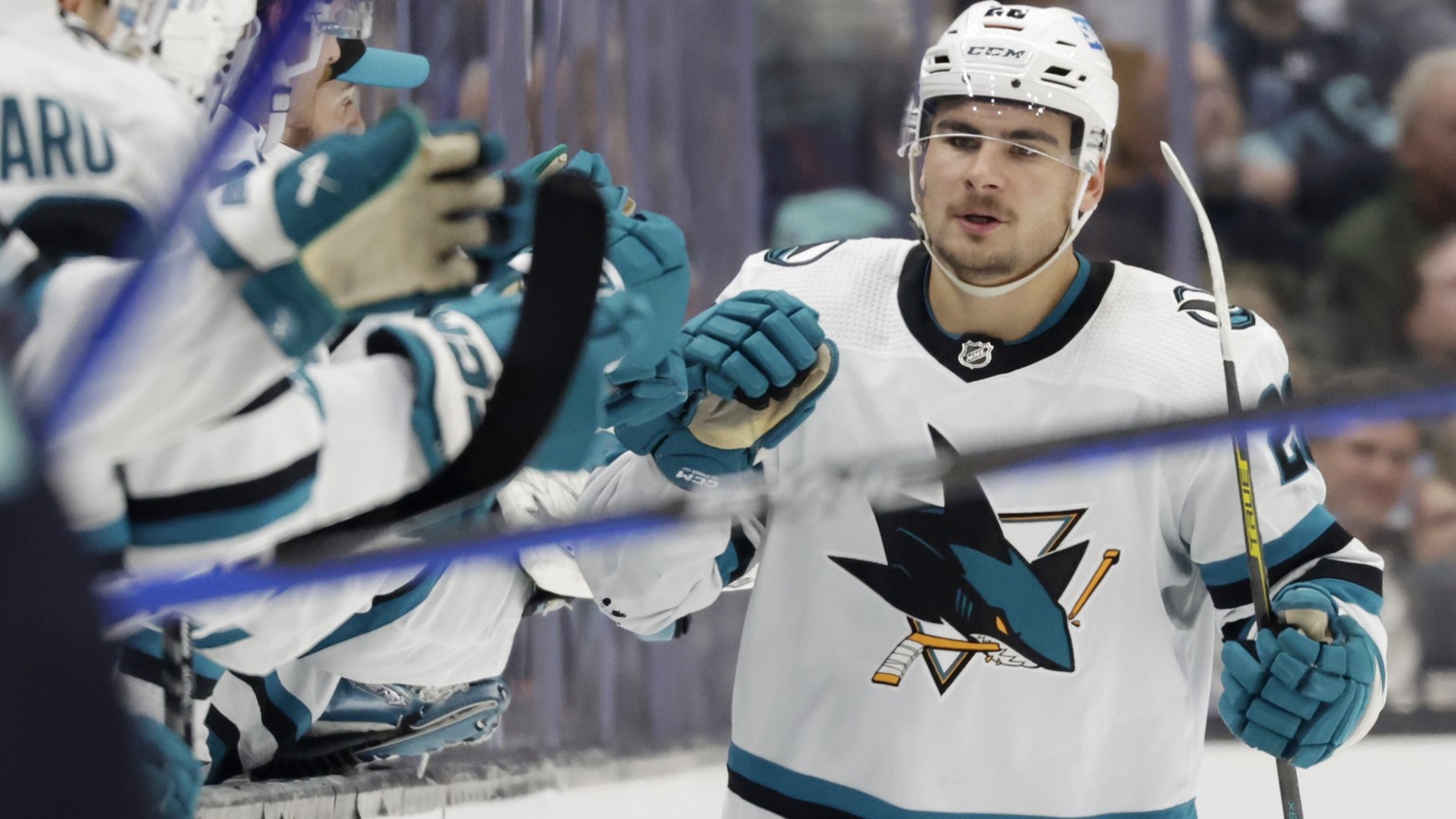 San Jose Sharks right wing Timo Meier (28) is congratulated after scoring against the Seattle Kraken during the second period of an NHL hockey game Wednesday, Nov. 23, 2022, in Seattle. (AP Photo/John ...