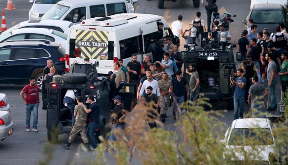 epa05427228 Turkish police arrest Turkish soldiers at the Taksim Square in Istanbul, Turkey, 16 July 2016. Turkish Prime Minister Yildirim reportedly said that the Turkish military was involved in an  ...