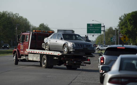 Hamrick&#039;s Towing &amp; Recovery hauls the Cadillac sedan that fugitives Casey White and Vicky White, no relation, were driving when law enforcement officials forced them into a ditch at Burch Dri ...
