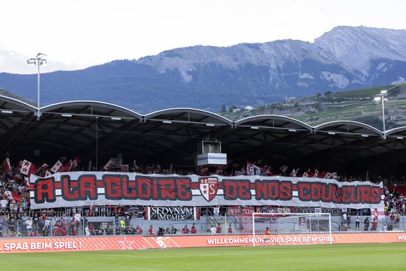 Sion&#039;s supporters cheer their players, prior the Super League soccer match of Swiss Championship between FC Sion and FC Servette, at the Stade de Tourbillon stadium, in Sion, Switzerland, Saturda ...