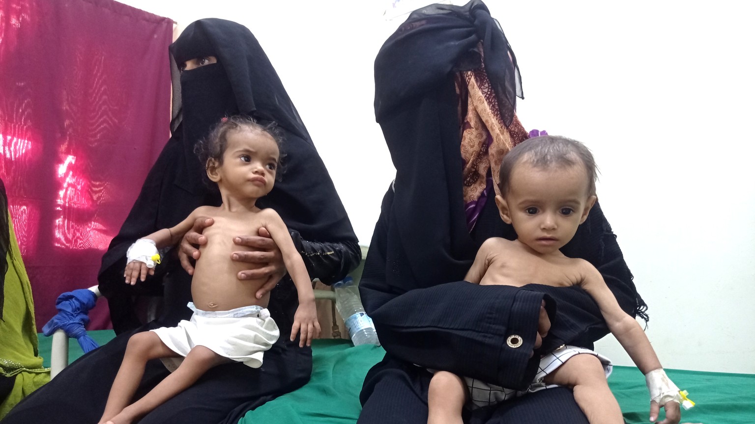 Women hold their malnourished children at Hays Rural Hospital in Hodeida, Yemen, Oct. 11, 2022. For years starvation has been an everyday threat for Yemen