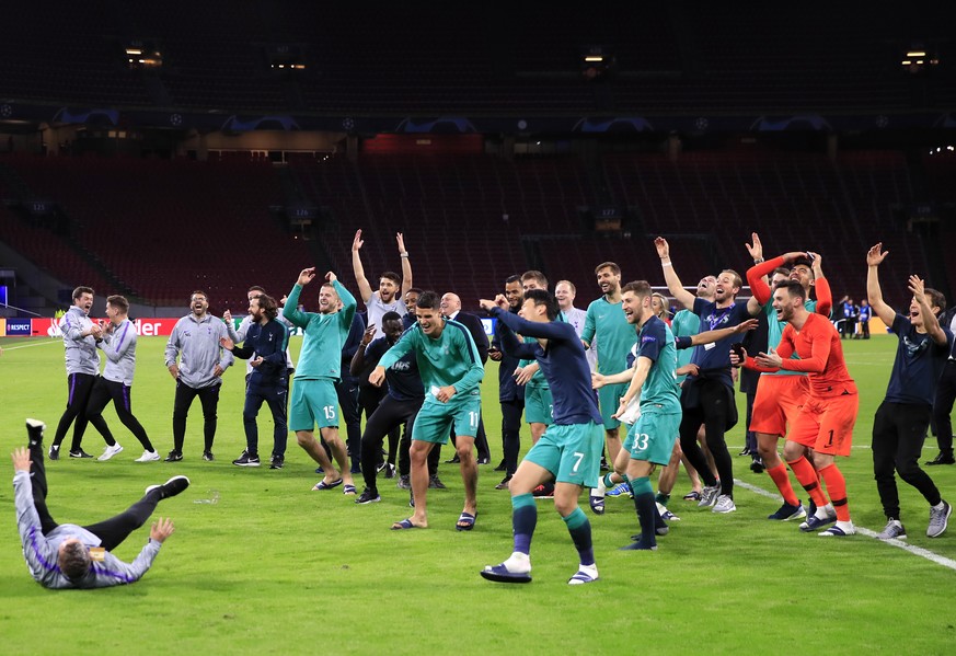Tottenham players and staff celebrate in front of the fans at the end of the Champions League semifinal second leg soccer match between Ajax and Tottenham Hotspur at the Johan Cruyff ArenA in Amsterda ...