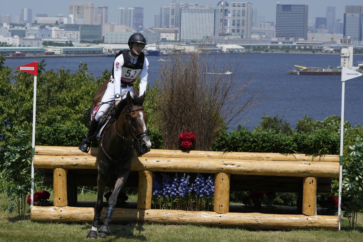 Switzerland's Robin Godel, riding Jet Set, competes during the Equestrian Eventing Cross Country competition at the Sea Forest Cross Country Course during the 2020 Summer Olympics, Sunday, Aug. 1 ...