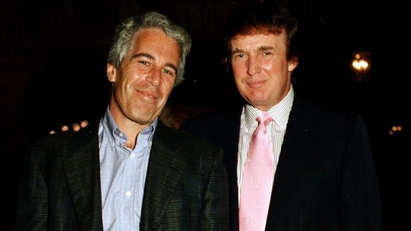 Portrait of American financier Jeffrey Epstein (left) and real estate developer Donald Trump as they pose together at the Mar-a-Lago estate, Palm Beach, Florida, 1997. (Photo by Davidoff Studios/Getty ...