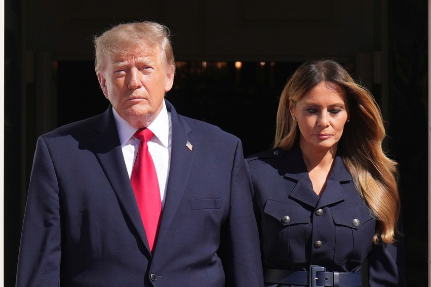 President Donald Trump, left, and first lady Melania Trump walk to greet China's President Xi Jinping and his wife Peng Liyuan as they arrive at the South Portico of the White House for tea, Frid ...
