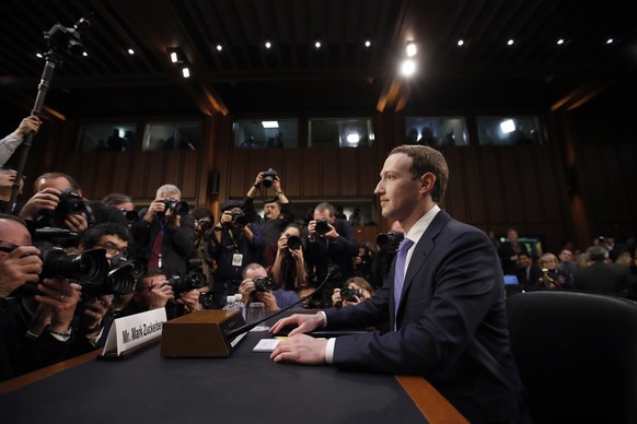 FILE - In this April 10, 2018, file photo, Facebook CEO Mark Zuckerberg takes his seat to testify before a joint hearing of the Commerce and Judiciary Committees on Capitol Hill in Washington. Reports ...