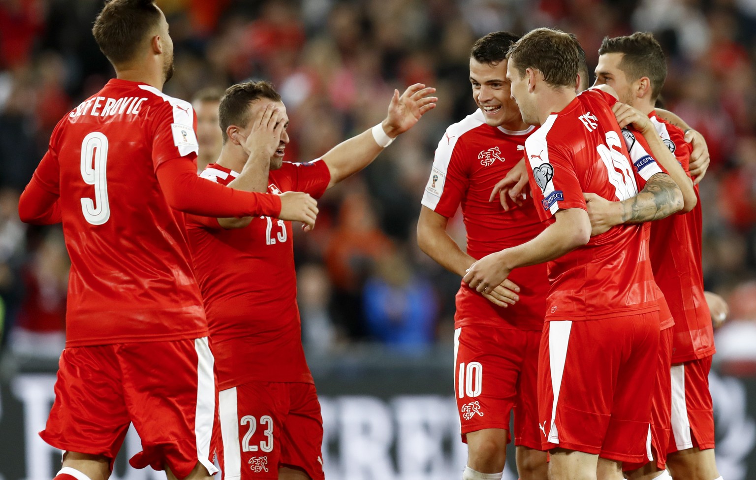 Switzerland&#039;s Haris Seferovic, Xherdan Shaqiri, Granit Xhaka, Fabian Frei, Steven Zuber (hidden) and Remo Freuler, from left, celebrate after Zuber scored the 4-0 during the 2018 Fifa World Cup R ...