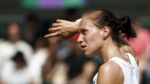 Viktorija Golubic of Switzerland reacts during her second round match against Lesia Tsurenko of Ukraine, at the Wimbledon Championships at the All England Lawn Tennis Club, in London, Britain, 06 July ...