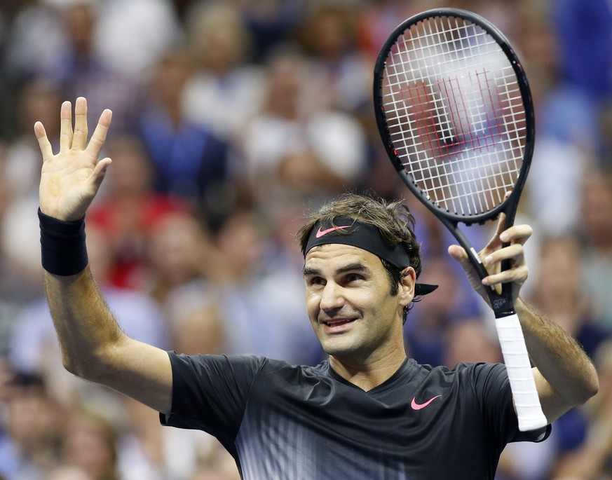 Roger Federer, of Switzerland, acknowledges the crowd after defeating Philipp Kohlschreiber, of Germany, 6-4, 6-2, 7-5, in a fourth-round match at the U.S. Open tennis tournament in New York, Monday,  ...