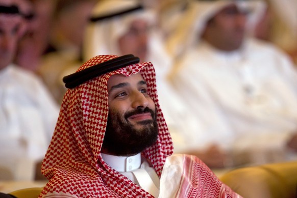 FILE - In this Tuesday, Oct. 23, 2018 file photo, Saudi Crown Prince Mohammed bin Salman smiles as he attends the Future Investment Initiative conference, in Riyadh, Saudi Arabia. Whether pressured to ...